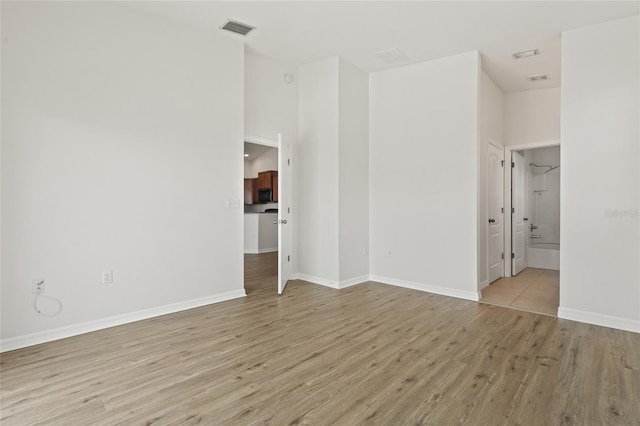 8848 Moonlit Meadows Loop, Riverview, FL 33578 - unfurnished room featuring wood finished floors, baseboards, and a towering ceiling