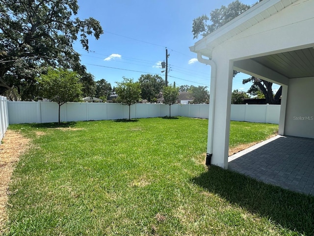 view of yard with a fenced backyard and a patio area