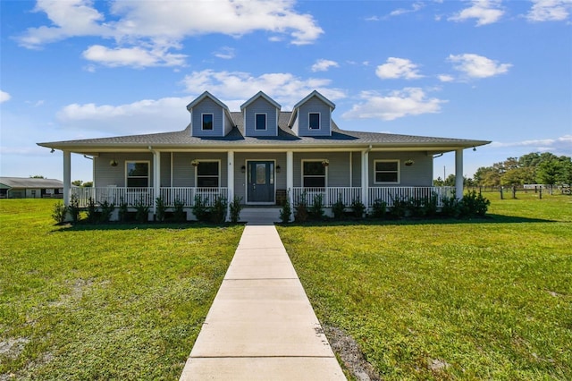 farmhouse inspired home with covered porch and a front yard