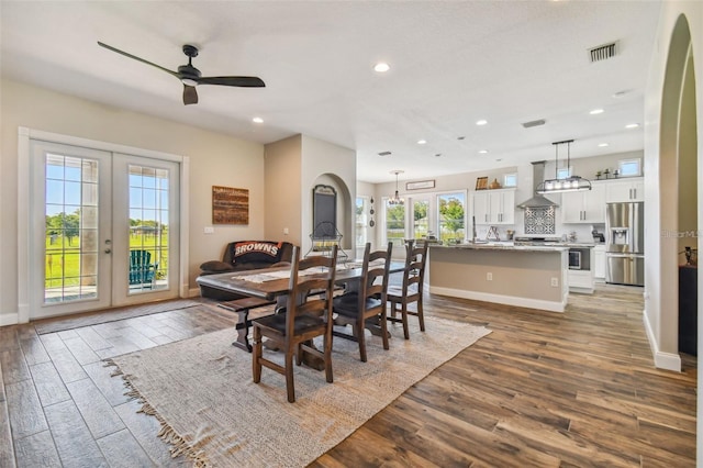 dining area featuring visible vents, wood finished floors, recessed lighting, french doors, and a ceiling fan
