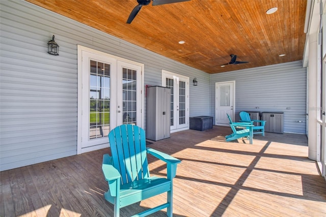 wooden deck featuring ceiling fan and french doors