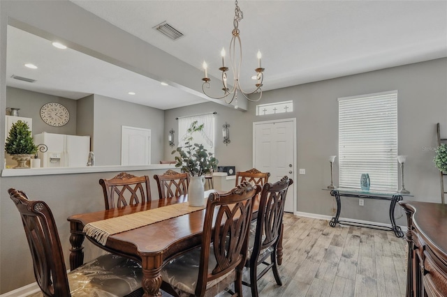 dining room featuring baseboards, recessed lighting, light wood-style flooring, and visible vents