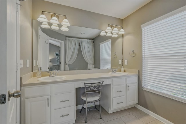full bath featuring tile patterned flooring, a sink, and double vanity