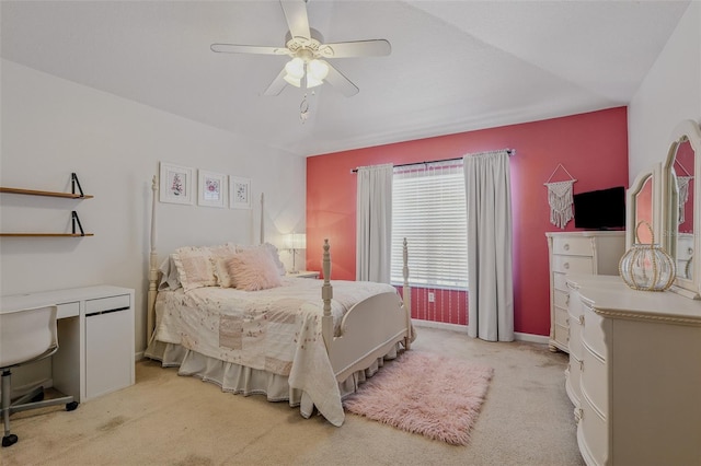 bedroom featuring light colored carpet, baseboards, and ceiling fan