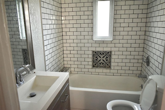 bathroom with toilet, shower / bath combination, and vanity