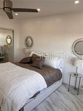 bedroom featuring recessed lighting and wood finished floors