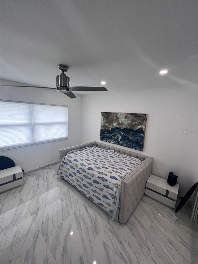 bedroom featuring a ceiling fan, recessed lighting, and marble finish floor