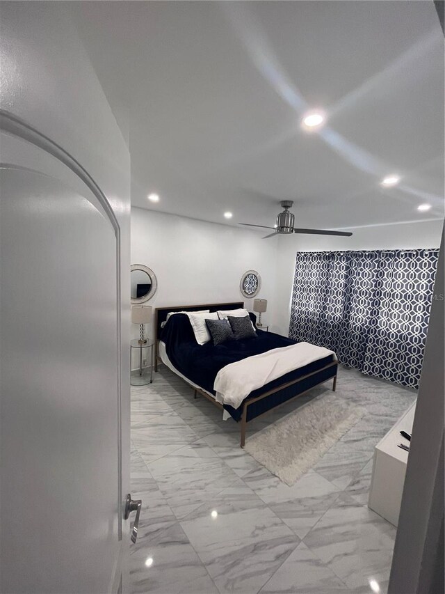 bedroom with recessed lighting, a ceiling fan, and marble finish floor