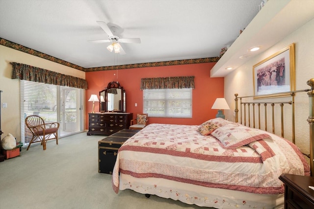 bedroom featuring ceiling fan and carpet