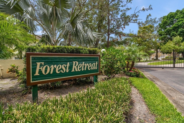 community sign with a gate and fence