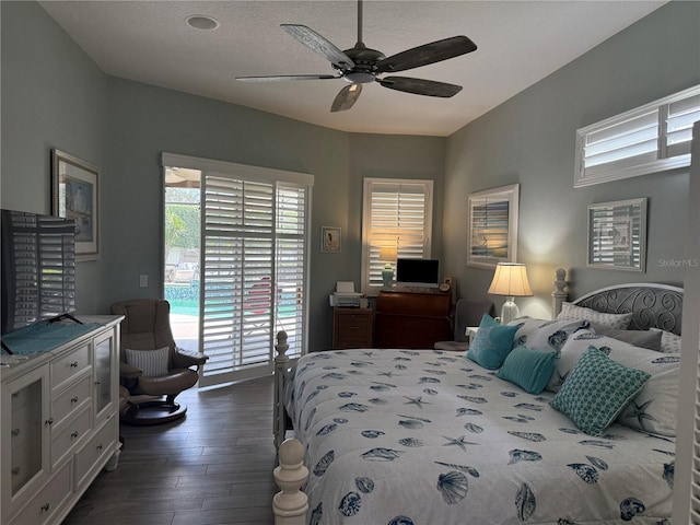 2908 89th Ave E, Parrish, FL 34219 - bedroom featuring dark wood-style flooring, access to outside, a desk, and a ceiling fan