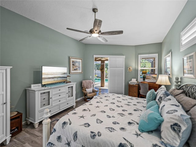 2908 89th Ave E, Parrish, FL 34219 - bedroom featuring access to exterior, dark wood-type flooring, ceiling fan, and baseboards