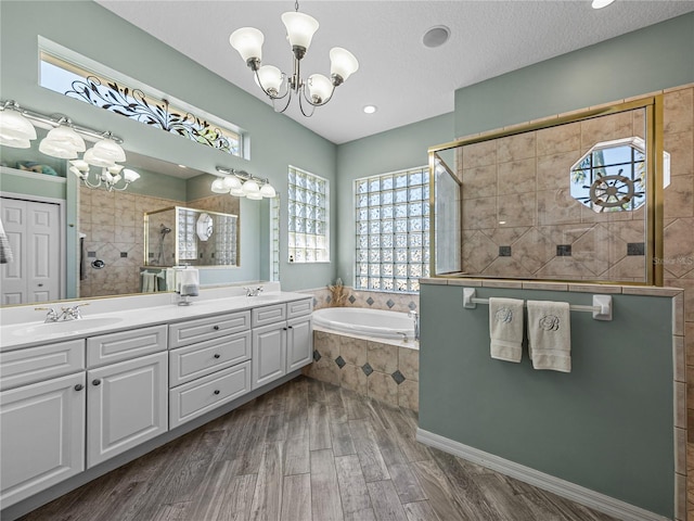 2908 89th Ave E, Parrish, FL 34219 - full bath featuring a chandelier, a walk in shower, a bath, and double vanity