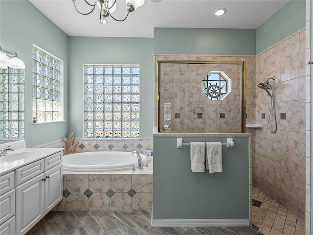2908 89th Ave E, Parrish, FL 34219 - full bathroom featuring healthy amount of natural light, a garden tub, vanity, and a walk in shower