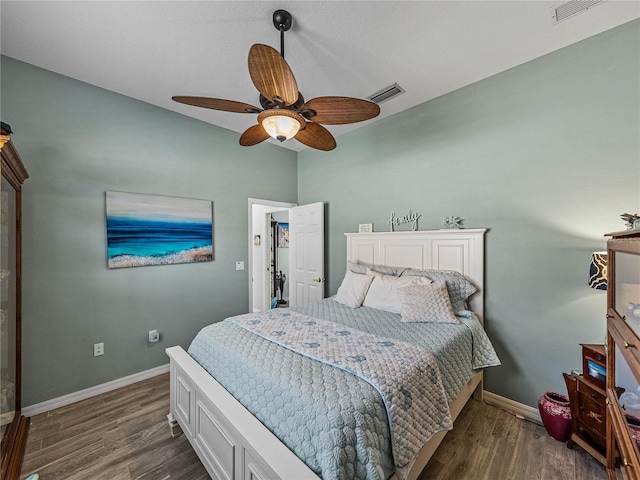 2908 89th Ave E, Parrish, FL 34219 - bedroom with dark wood-style flooring, baseboards, and ceiling fan