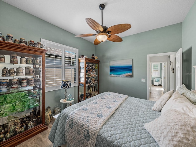 2908 89th Ave E, Parrish, FL 34219 - bedroom featuring wood finished floors and a ceiling fan