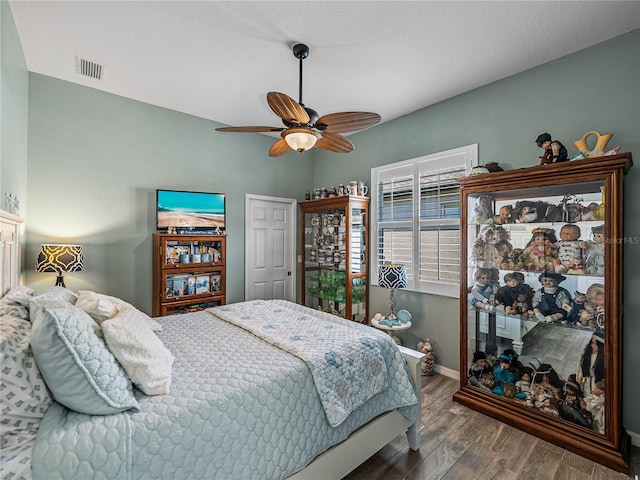 2908 89th Ave E, Parrish, FL 34219 - bedroom featuring baseboards, wood finished floors, and ceiling fan