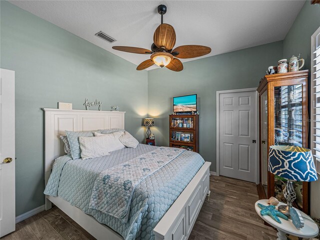 2908 89th Ave E, Parrish, FL 34219 - bedroom with baseboards, a ceiling fan, lofted ceiling, and dark wood-style floors