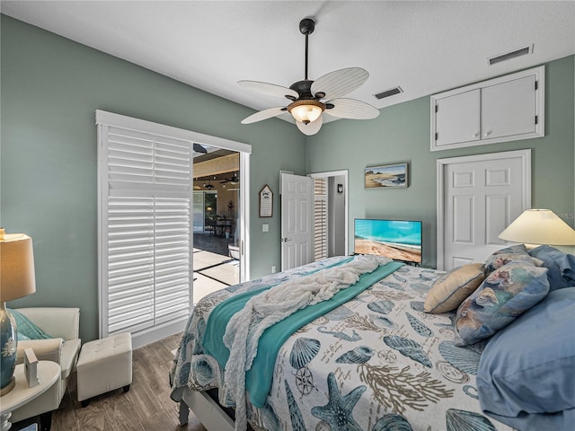 2908 89th Ave E, Parrish, FL 34219 - bedroom with wood finished floors and a ceiling fan