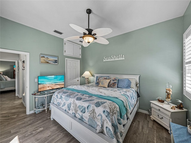 2908 89th Ave E, Parrish, FL 34219 - bedroom featuring dark wood finished floors, baseboards, and ceiling fan