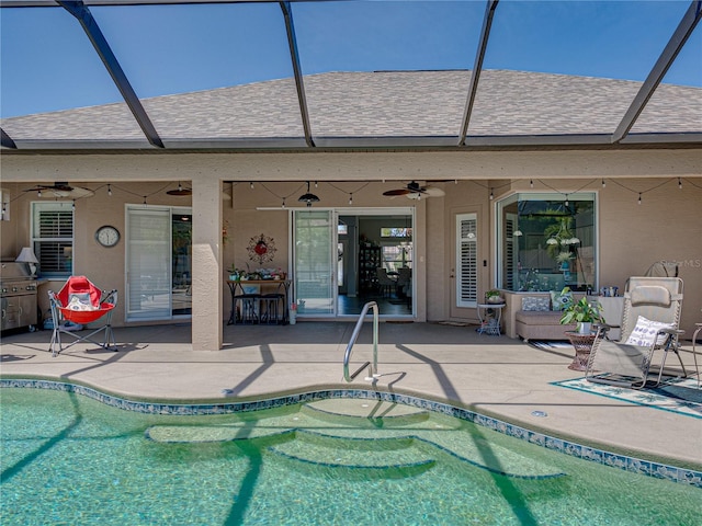 2908 89th Ave E, Parrish, FL 34219 - outdoor pool with a ceiling fan, a patio, and glass enclosure