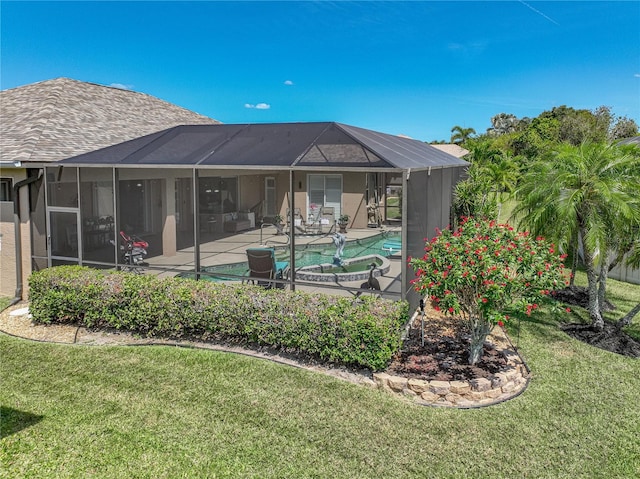 2908 89th Ave E, Parrish, FL 34219 - rear view of house featuring a patio, a lawn, an outdoor pool, and a lanai
