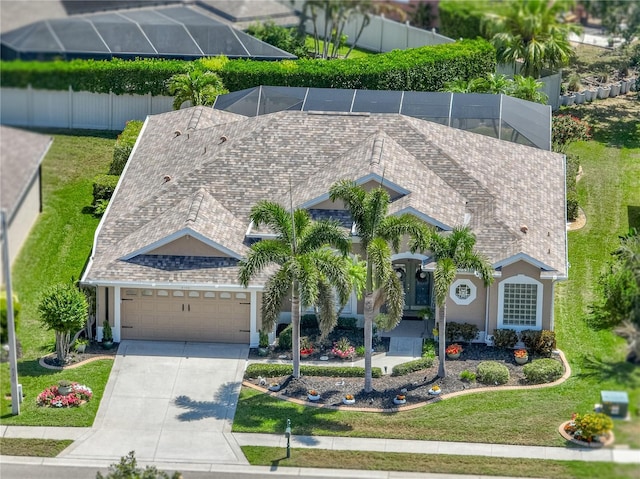 2908 89th Ave E, Parrish, FL 34219 - view of front facade featuring an attached garage, driveway, and a lanai