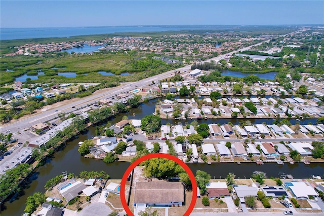 bird's eye view featuring a water view and a residential view