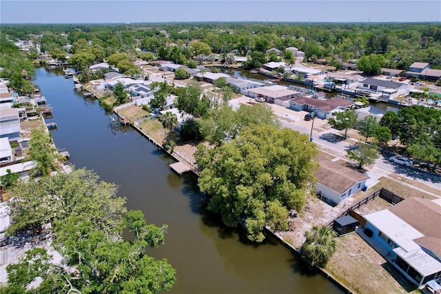 drone / aerial view with a water view and a residential view