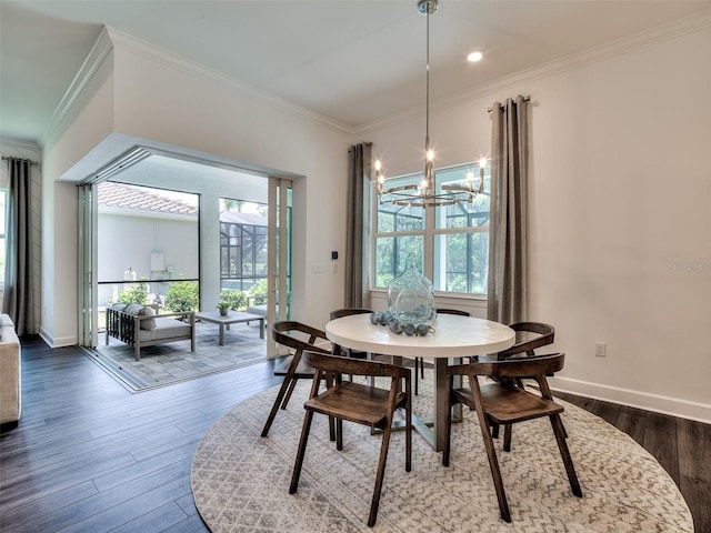 14727 Eagle Branch Dr, Nokomis, FL 34275 - dining space featuring crown molding, an inviting chandelier, a wealth of natural light, and wood finished floors