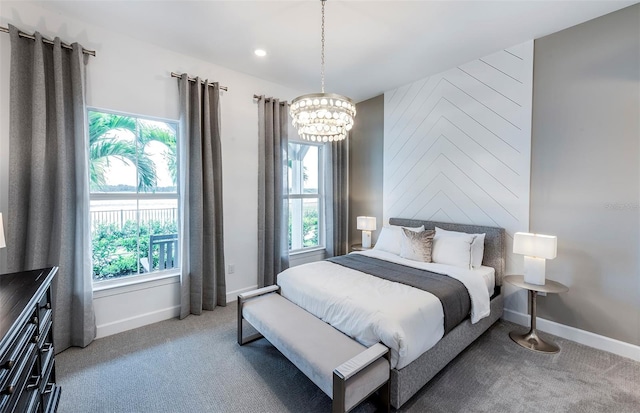 14727 Eagle Branch Dr, Nokomis, FL 34275 - bedroom featuring an inviting chandelier, multiple windows, and light colored carpet