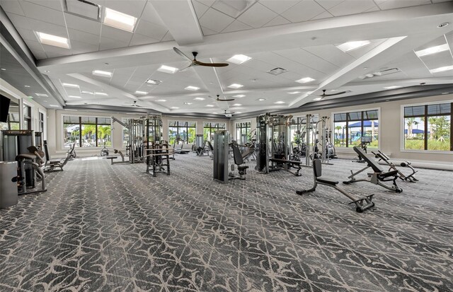 14727 Eagle Branch Dr, Nokomis, FL 34275 - gym featuring carpet floors, ceiling fan, and coffered ceiling