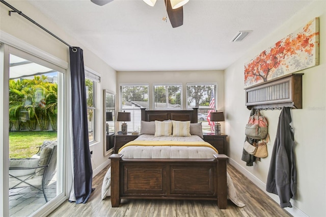 bedroom with access to outside, ceiling fan, light wood-style flooring, baseboards, and visible vents