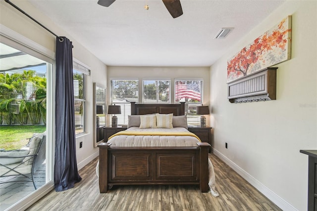4403 W Bay Court Ave, Tampa, FL 33611 - bedroom with wood finished floors, baseboards, access to exterior, and ceiling fan