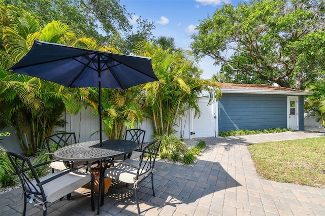 4403 W Bay Court Ave, Tampa, FL 33611 - view of patio / terrace with outdoor dining area and fence