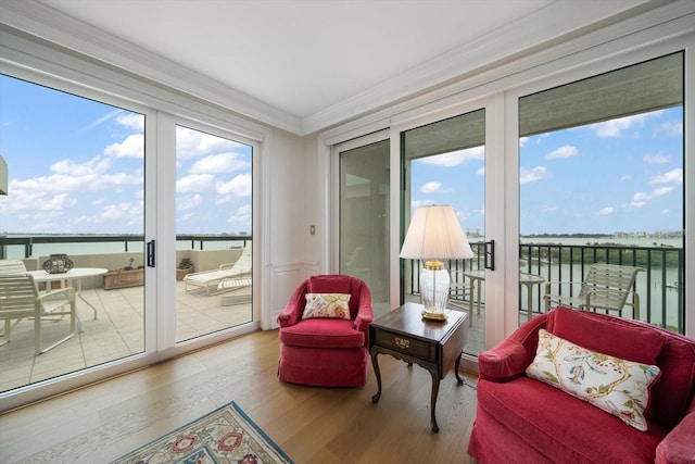 4 Belleview Blvd Unit 802, Belleair, FL 33756 - sunroom / solarium featuring crown molding, a water view, and wood finished floors