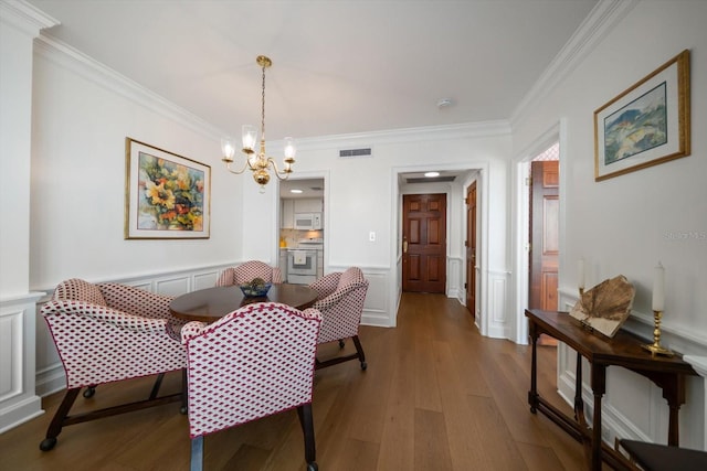 4 Belleview Blvd Unit 802, Belleair, FL 33756 - interior space with crown molding, a decorative wall, a chandelier, wood finished floors, and visible vents