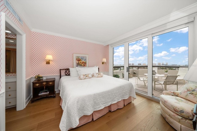 4 Belleview Blvd Unit 802, Belleair, FL 33756 - bedroom with crown molding, access to outside, wallpapered walls, and light wood finished floors