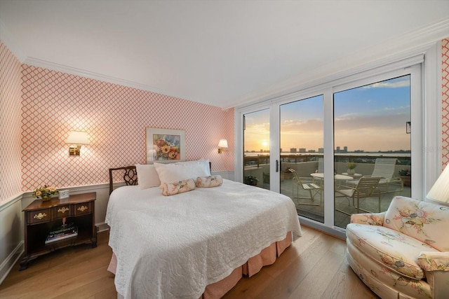 4 Belleview Blvd Unit 802, Belleair, FL 33756 - bedroom with access to outside, wallpapered walls, ornamental molding, and hardwood / wood-style flooring