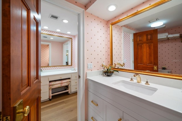 4 Belleview Blvd Unit 802, Belleair, FL 33756 - bathroom featuring vanity, recessed lighting, wallpapered walls, wood finished floors, and visible vents