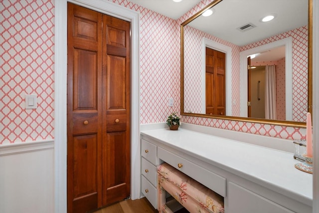 4 Belleview Blvd Unit 802, Belleair, FL 33756 - bathroom with vanity, wallpapered walls, wood finished floors, and visible vents