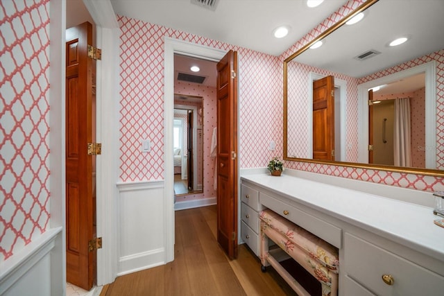 4 Belleview Blvd Unit 802, Belleair, FL 33756 - bathroom featuring wallpapered walls, wood finished floors, and visible vents