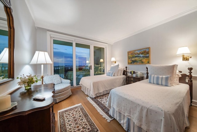 4 Belleview Blvd Unit 802, Belleair, FL 33756 - bedroom with crown molding, wood finished floors, and access to outside