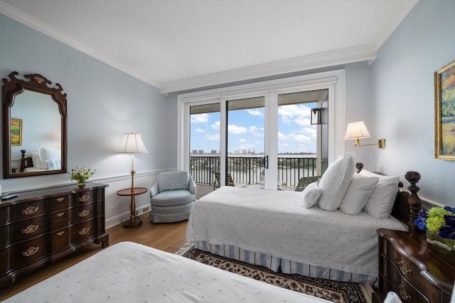 4 Belleview Blvd Unit 802, Belleair, FL 33756 - bedroom with ornamental molding, wood finished floors, baseboards, access to outside, and a water view