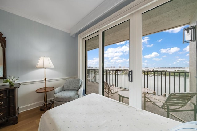 4 Belleview Blvd Unit 802, Belleair, FL 33756 - bedroom featuring access to exterior, baseboards, wood finished floors, a water view, and ornamental molding