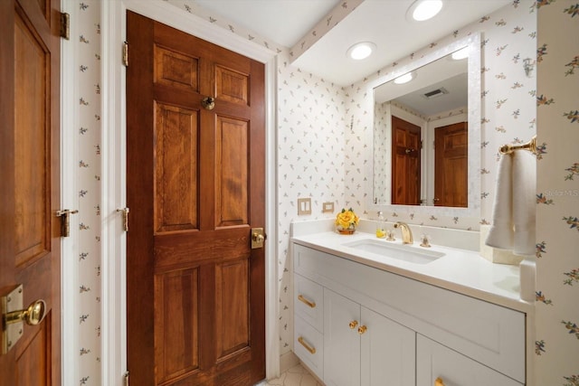 4 Belleview Blvd Unit 802, Belleair, FL 33756 - bathroom featuring vanity, wallpapered walls, and visible vents