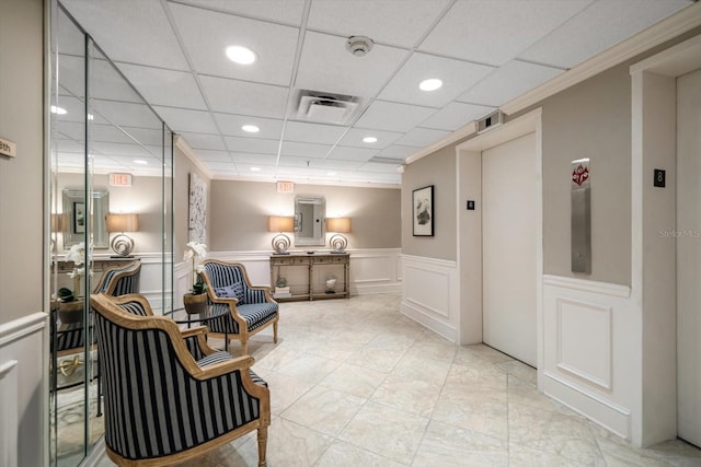 4 Belleview Blvd Unit 802, Belleair, FL 33756 - living area featuring a decorative wall, elevator, a paneled ceiling, a wainscoted wall, and recessed lighting