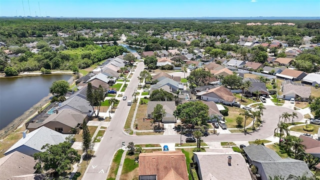 bird's eye view featuring a water view and a residential view