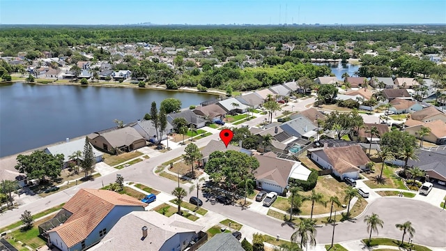 birds eye view of property featuring a residential view and a water view