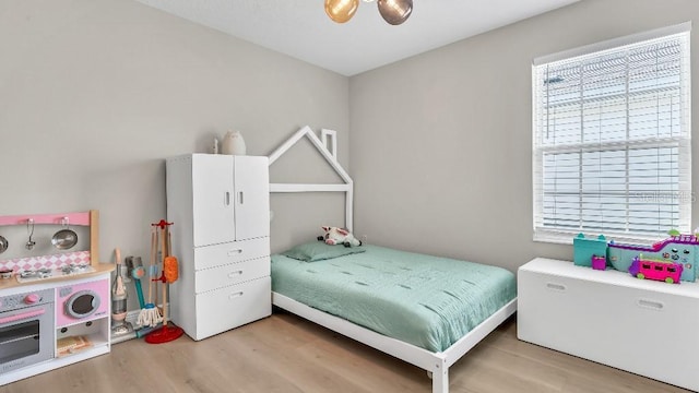 bedroom featuring wood finished floors